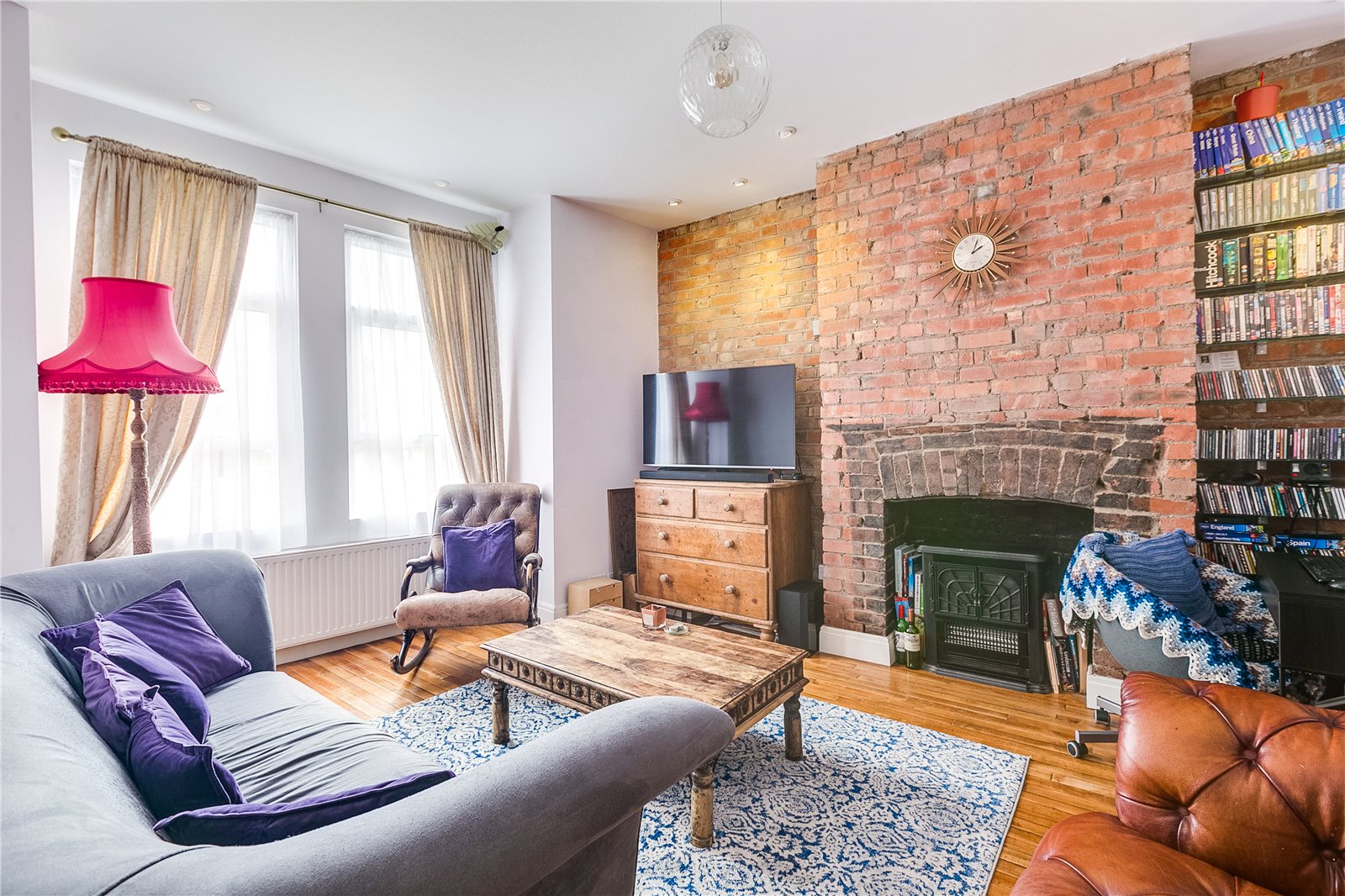 living room with exposed brick walls